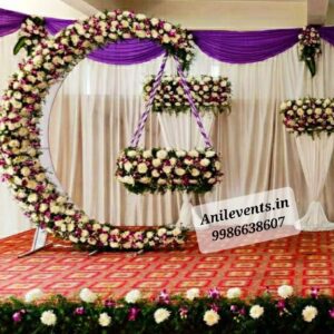 Book Cradle Flowers Decorations for Naming Ceremony in Bangalore. Make your event memorable with beautiful decorations by Anil Events Bangalore we arrange beautiful table centerpieces using fresh flowers, delicate figurines amazing naming ceremony decor that can enhance the beauty and elegance of the occasions, Trendy Naming Ceremony Decorations in different themes with Backdrops and Flowers in Bangalore Cradle Decoration For Baby Girl / Baby Boy Soft Theme Naming Ceremony Cradle Decoration