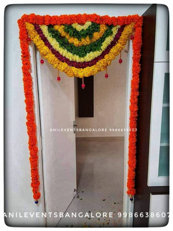 Express love and respect for the divine using flowers. Its significant part of the ritual. They are considered a manifestation of devotional emotion. Shop for the best flower door decorations from our collection of exclusive, customized & handmade Flower garlands for your Main door and Pooja room for any kind of occasions. By Anil Events Bangalore Shamanthige flower / Chrysanthemum and Marigold flowers are most popular and beautiful flowers of all time used to decorate homes. They come in a wide range of colours and varieties, so there is sure to be a type that will fit perfectly into any space