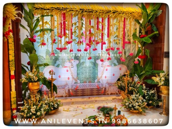 Celebrate New Beginnings with Charming Housewarming Decorations with Anil Events Bangalore we offer personalized decor solutions for Traditional decorations for Griha Pravesha / Housewarming ceremony, Transform your new home into a haven of beauty with Mango leaf toran, flowers, and simple rangoli and with traditional Backdrop it will give you Heartfelt Party Decor for Your New Home. We can decorate your home with strands of flowers- orange or yellow marigolds which can be strung everywhere in your home (such as doors, gates, and steps)
