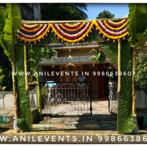 Discover stunning Indian wedding stage decorations with an elaborately decorated canopy in the middle of palm trees. Perfect for traditional