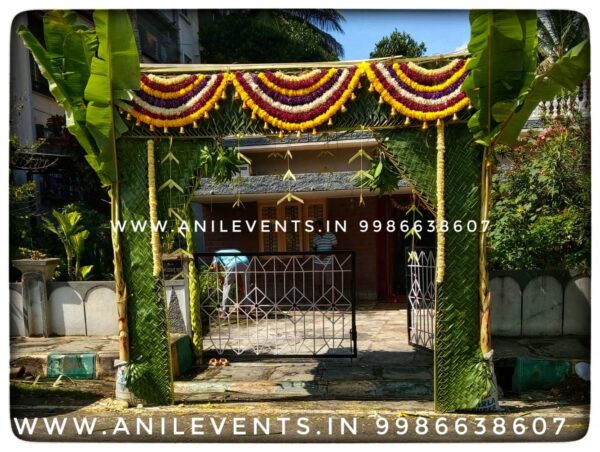 Discover stunning Indian wedding stage decorations with an elaborately decorated canopy in the middle of palm trees. Perfect for traditional